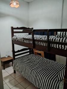a couple of bunk beds in a room at Granja Triple A in Guatemala
