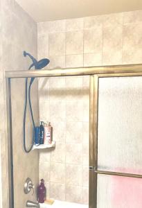 a shower in a bathroom with a shower head at B1 A private room in Naperville downtown with desk and Wi-Fi near everything in Naperville