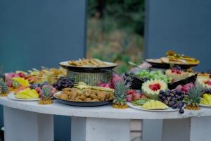 a table filled with different types of fruits and vegetables at The Meander Estate in Balmoral