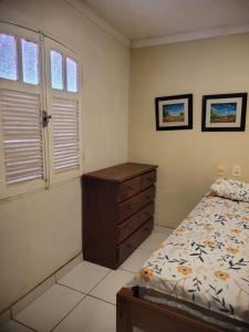 Кровать или кровати в номере Perobas beach house