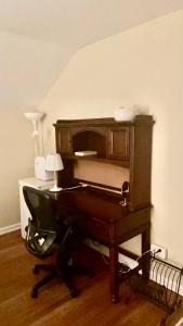 an old piano sitting in a room with a lamp at B1 A private room in Naperville downtown with desk and Wi-Fi near everything in Naperville
