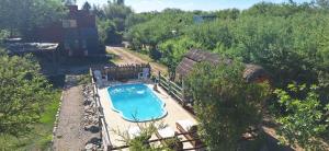 an overhead view of a swimming pool in a yard at Casitas Volver a Nacer in Carpintería +45 photos