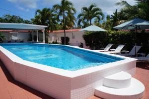 a large swimming pool with a brick wall at Bravo Beach Hotel in Vieques