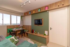 a living room with a sliding door and a table at Maravilhoso Próx. Atitus c/Garagem NOVO in Passo Fundo