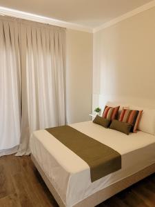 Cama o camas de una habitación en Sobrado com garagem e churrasqueira