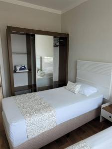 Cama o camas de una habitación en Sobrado com garagem e churrasqueira
