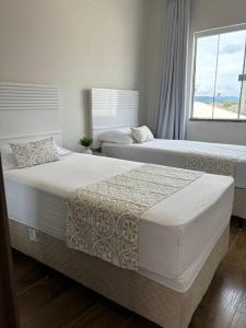 Cama o camas de una habitación en Sobrado com garagem e churrasqueira