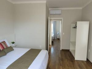 Cama o camas de una habitación en Sobrado com garagem e churrasqueira