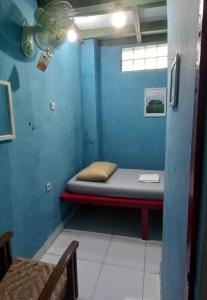 Postel nebo postele na pokoji v ubytování Benara Shariah Homestay