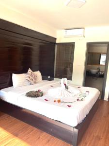 מיטה או מיטות בחדר ב-Sapa Village Hotel