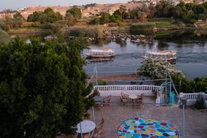a view of a river with boats in the water at Nubian Beach - حسن فوكس in Aswan