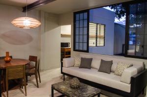a living room with a couch and a table at Lofts Marques Oaxaca in Oaxaca City