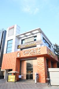 a building with a chihuahua restaurant at Hotel Supraja Yellow Bells in Hyderabad