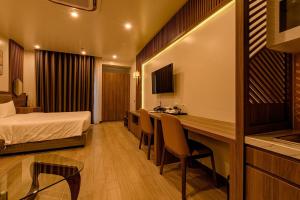a hotel room with a bed and a desk at ZEN RIVERSIDE HOTEL & RESIDENCES in Hai Phong