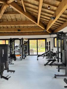 a gym with lots of treadmills and weights at Apartamento studio novo e completo em Praia do Forte! 900m da Vila! in Praia do Forte