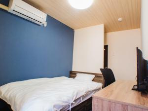 Postel nebo postele na pokoji v ubytování Shima no Hotel