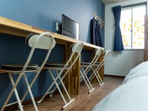 Postel nebo postele na pokoji v ubytování Shima no Hotel