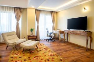TV o dispositivi per l'intrattenimento presso Atisha Hotel