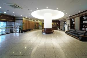 a lobby with a large light fixture in a building at Incheon The Hotel Yeongjong in Incheon