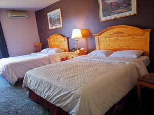 Postel nebo postele na pokoji v ubytování Hotel Alila