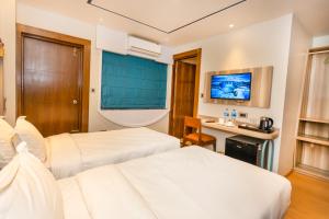 Voodi või voodid majutusasutuse Ananta Home toas