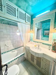 a bathroom with a tub and a sink and a toilet at Villa Rural junto a la playa - SUN & RELAX in Marbella