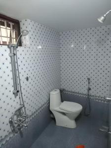Koupelna v ubytování Cloudnine Home Thrissur