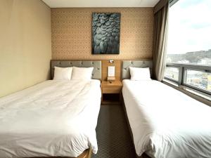 Postel nebo postele na pokoji v ubytování Mohenic Hotel Seoul Myeongdong