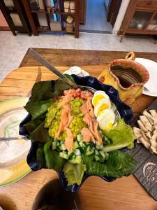a plate of food on a wooden table at 快樂鼠樓中樓4-6人房 in Taitung City