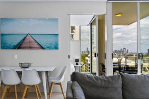a living room with a view of the ocean at Spectacular City & Harbour Views: Bondi Junction in Sydney