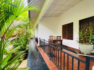 A balcony or terrace at Priyavimana resort