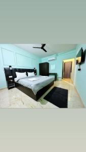 a bedroom with a bed and a ceiling at North & East Arambol I Goa in Arambol