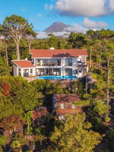 an aerial view of a house in the forest at Atlantic Heritage Luxury Villa in Madalena