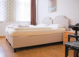 Postel nebo postele na pokoji v ubytování Hotel Lübecker Hof