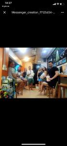 a group of people sitting in a room at Voyagers Hostel in Phi Phi Don