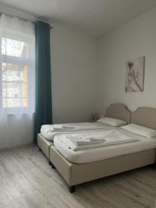 Postel nebo postele na pokoji v ubytování Hotel Lübecker Hof