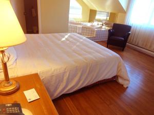 Postel nebo postele na pokoji v ubytování Hotel Alila