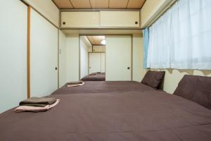 Ένα ή περισσότερα κρεβάτια σε δωμάτιο στο 札幌市中心部大通公園まで徒歩十分観光移動に便利なロケーションh205#13