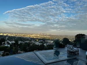 a view of a city from the roof of a building at Skyline Serenity Luxe Suite-Private Room in Los Angeles