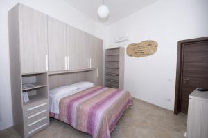 Ένα ή περισσότερα κρεβάτια σε δωμάτιο στο La Casa Di Tina