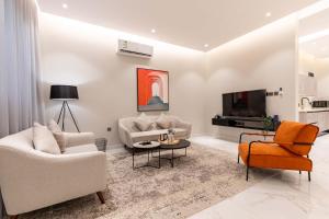 TV a/nebo společenská místnost v ubytování Amber Hospitality - Al Qairawan