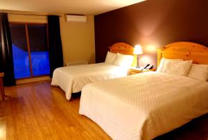 Postel nebo postele na pokoji v ubytování Hotel Alila