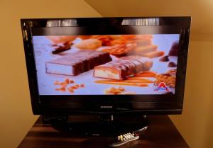 TV a/nebo společenská místnost v ubytování Hotel Alila