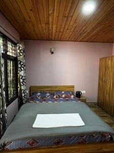 Llit o llits en una habitació de Hidden Cottage