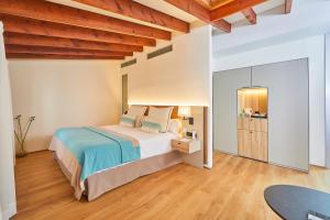 Postel nebo postele na pokoji v ubytování Santa Clara Urban Hotel & Spa
