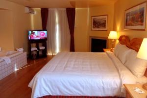 Postel nebo postele na pokoji v ubytování Hotel Alila