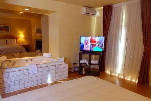 Postel nebo postele na pokoji v ubytování Hotel Alila