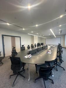 a large conference room with a large table and chairs at Darin Hotel in Erbil