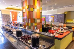 a buffet line in a restaurant with food at Hotel Wing International Premium Tokyo Yotsuya in Tokyo