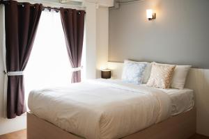 Postel nebo postele na pokoji v ubytování Prix Hotel